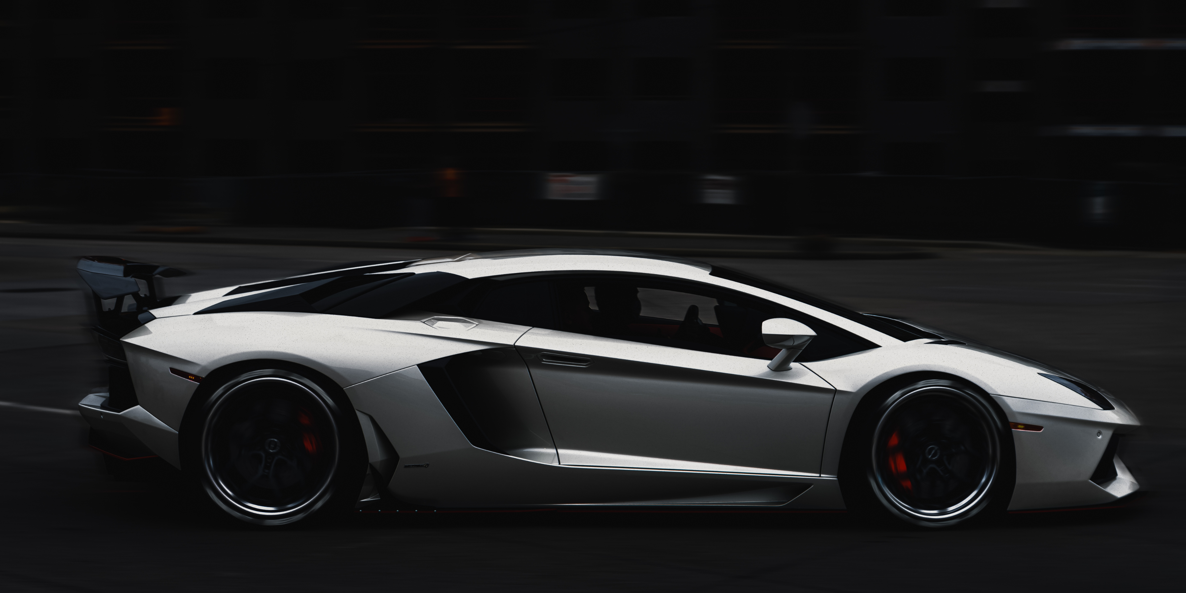 Sleek sports car racing on a dark track, symbolizing high-speed performance and innovation for Gletscher EV accessories.