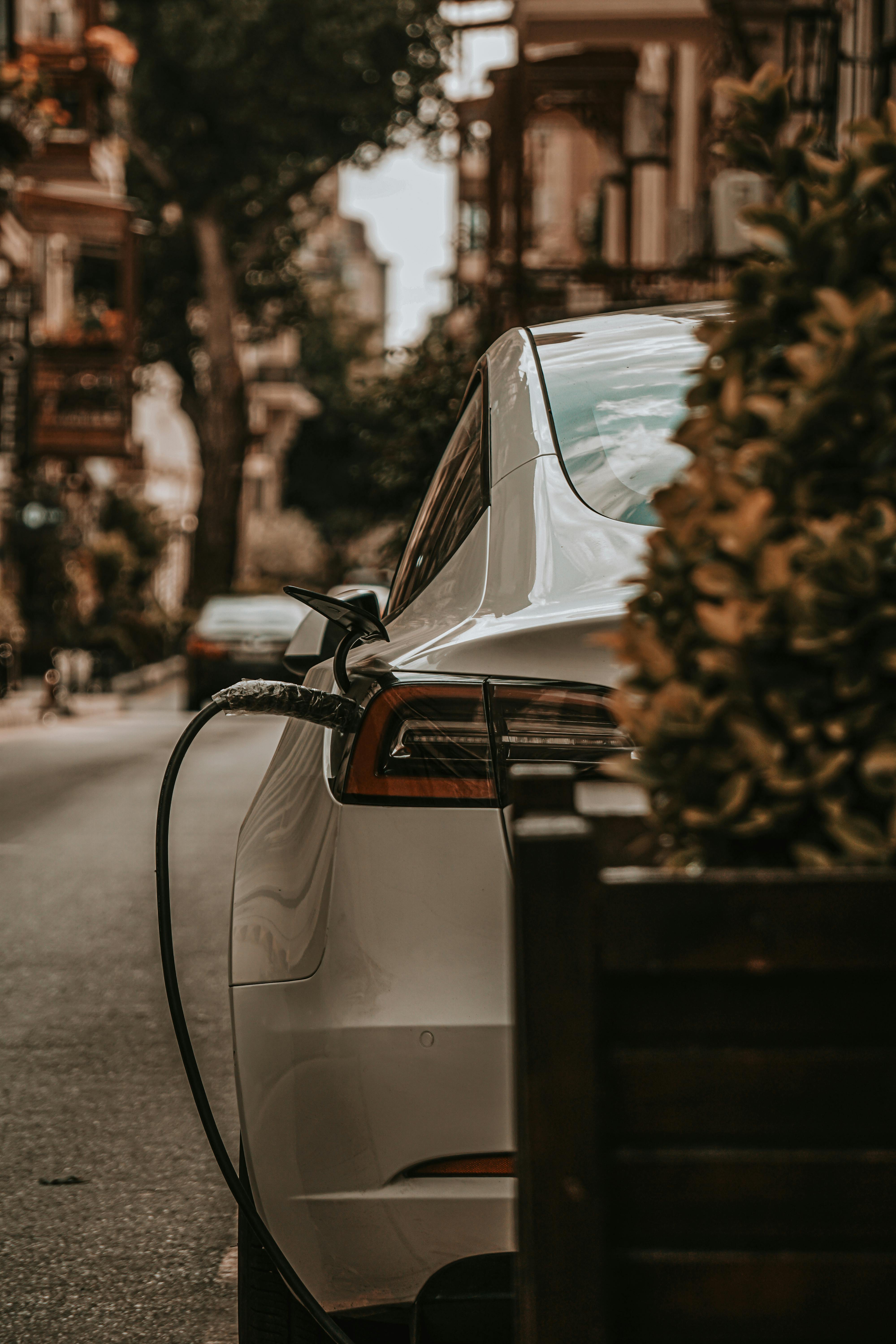 Electric vehicle charging on a residential street—representing growing EV infrastructure needs in urban environments across the GCC and Africa.