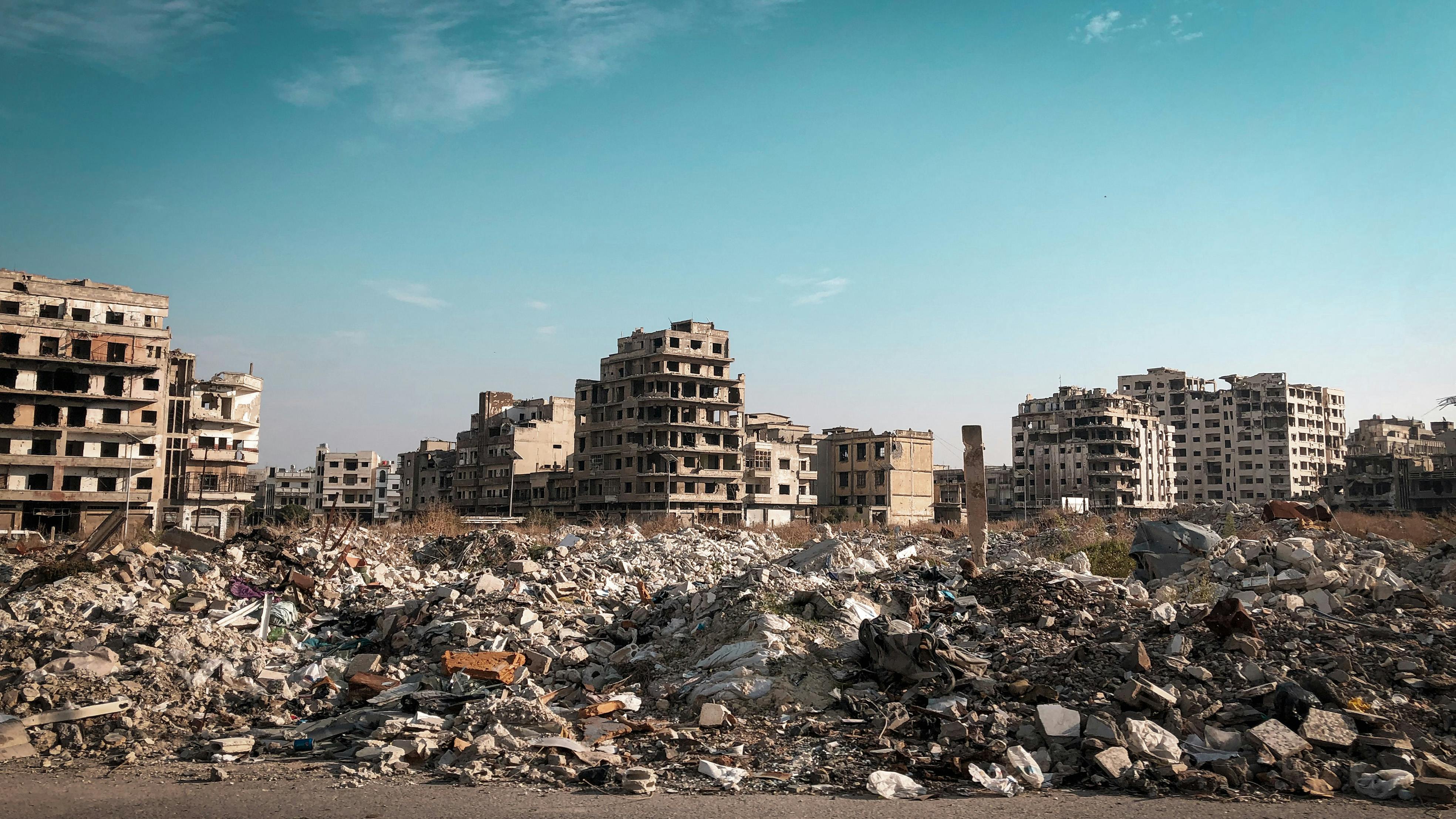 War-damaged buildings and destroyed infrastructure in the Middle East highlighting the impact of the Iran–Israel conflict on cities, infrastructure, and energy security.